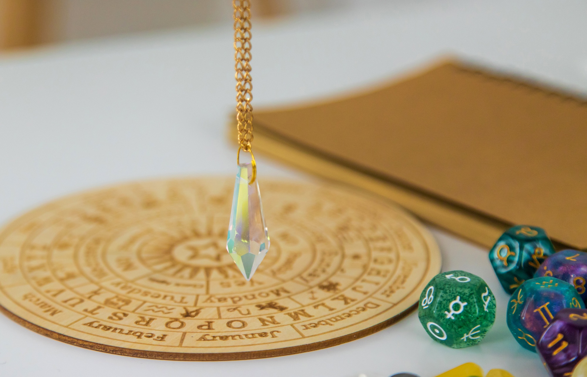 Pendulum numerologist astrologer and zodiac signs. Selective focus.